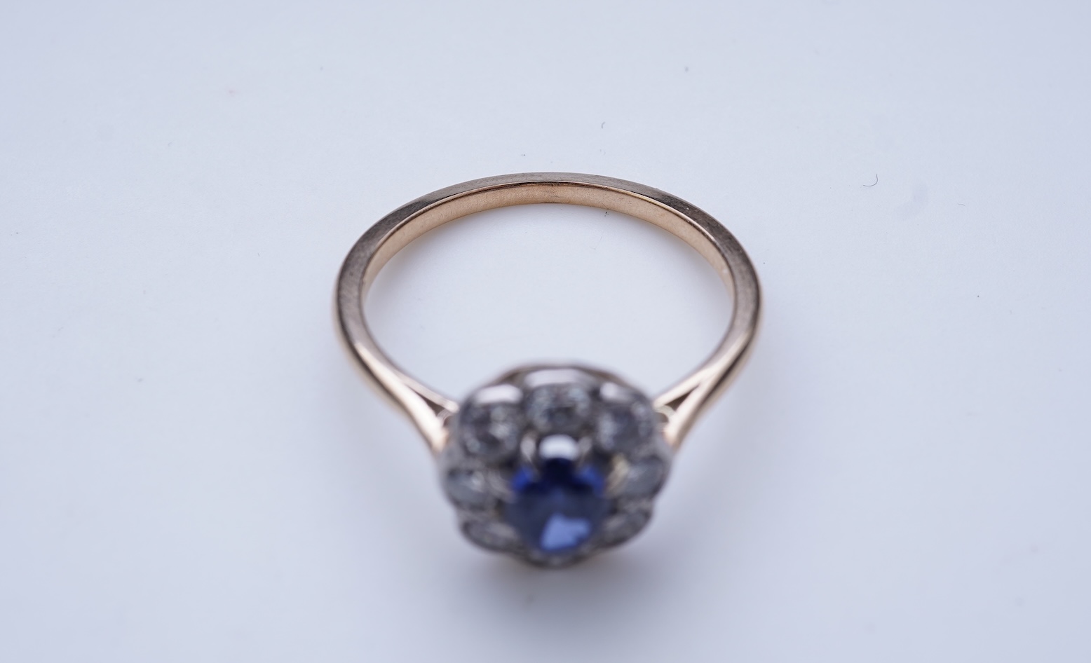 A synthetic sapphire and diamond ring